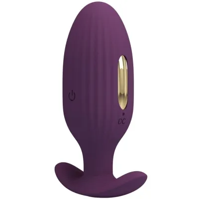 Purple, ribbed, oval device with gold accents and a stand; power and charging port visible.