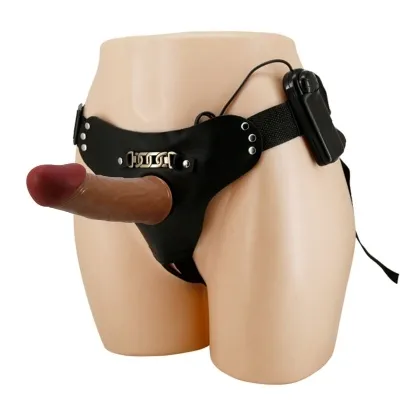 Schwarzer Strap-On-Gürtel mit realistischem Dildo und Fernbedienung auf einem Mannequin.