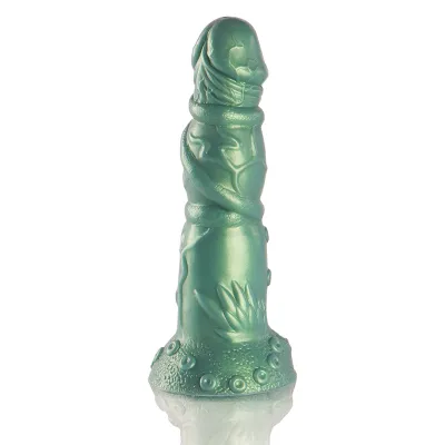 Green, sculptural object with organic patterns and textured surface, standing on a reflective background.