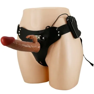 A black strap-on with a flesh-colored dildo and a small hand, attached to a model.