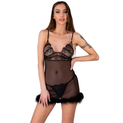 Woman in a black, transparent negligee with lace and feathers, standing against a white background.