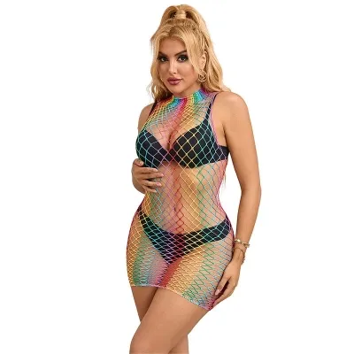 Woman in a black bikini and colorful mesh dress, smiling, with blonde hair and gold earrings.