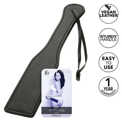 Black paddle made of vegan leather with a sturdy handle, label and warranty seal.
