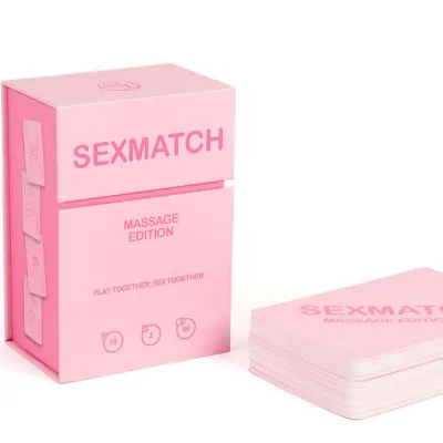 A pink card game box labeled "Sexmatch Massage Edition", with a stack of cards next to it.