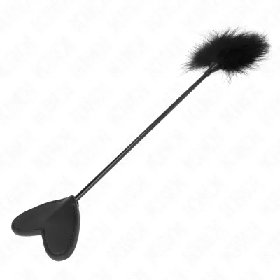 Black riding crop with heart shape and fluffy end on a white background.