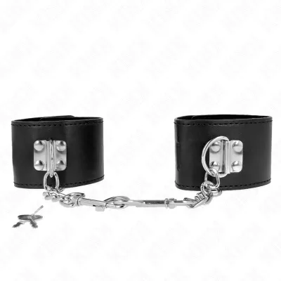 Black leather handcuffs with silver chain and key on a white background.