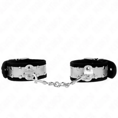 Silberne Handfesseln mit schwarzem Innenfutter, verbunden durch eine kurze Kette.