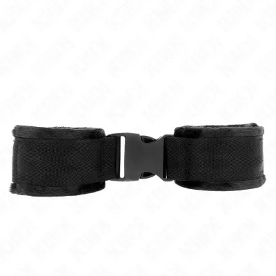Black, padded handcuffs with buckle closure on a white background.