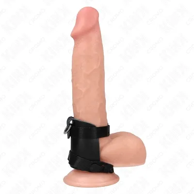 A realistic dildo with suction cup and black strap on a white background.