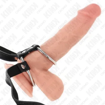 A dildo with a black leather strap and metal rings.