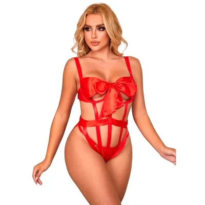 Woman in red lingerie with a bow, posing in front of a white background.