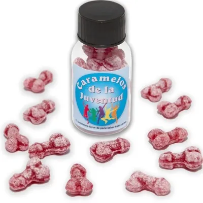 Flasche mit roten Bonbons in Penisform, Etikett "Caramelos de la Juventud", einige Bonbons liegen daneben.