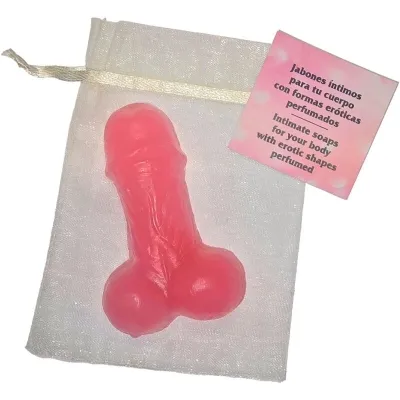 Pink soap in an erotic shape on a white bag with a label in Spanish and English.