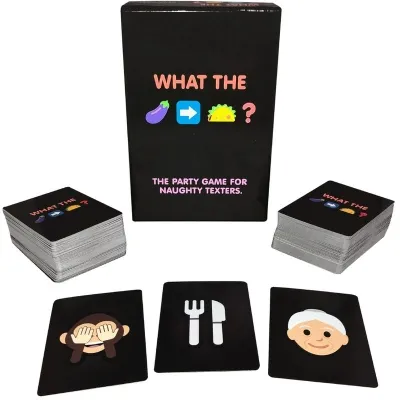 Kartenspiel "What The" mit Emojis auf Karten, darunter Affe, Besteck und Oma. Verpackung im Hintergrund.