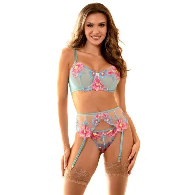 Woman in blue, floral-patterned lingerie with garter belt and stockings, smiling.