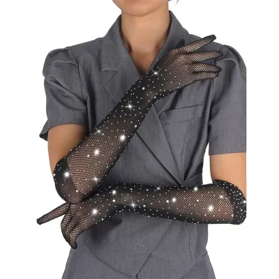 The person is wearing glittery black mesh gloves and a grey top.