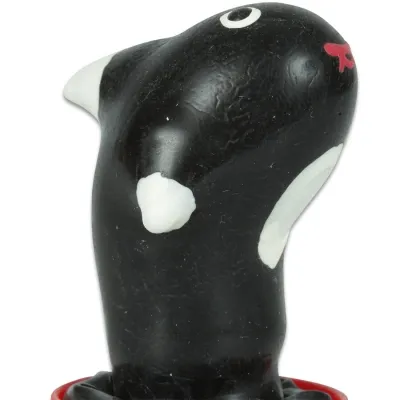 Black and white toy in the shape of an animal with red details, on a white background.
