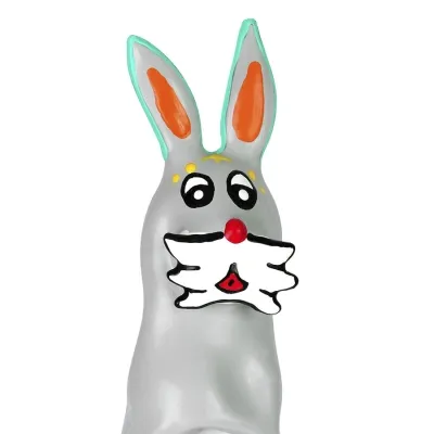 Grey chocolate bunny with colorful details, big eyes and red ears.