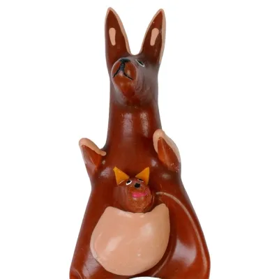 Ceramic kangaroo with baby in pouch, brown and orange, on a white background.