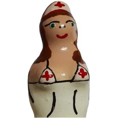 Clay figure of a nurse with a red cross on her clothing, hand-painted.