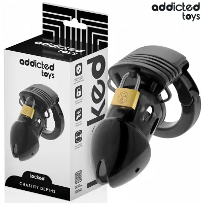 Black chastity device with padlock, packaging from "Addicted Toys" in the background.