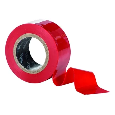 Roll of red adhesive tape, partially unrolled, on a white background.