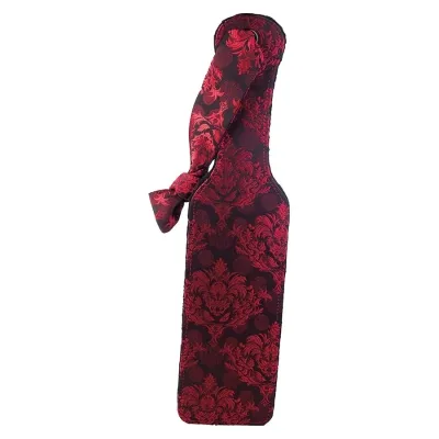 Wine bottle in a red, patterned fabric cover with a bow.