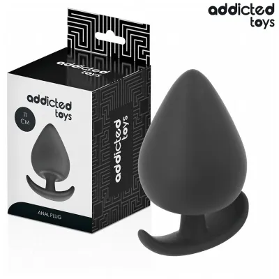 Black anal plug from Addicted Toys, 11 cm, next to the packaging.