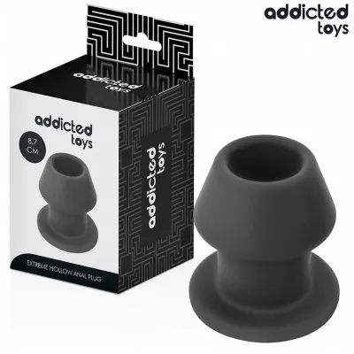 Schwarzer, hohler Analplug von Addicted Toys neben der Verpackung, 8,7 cm groß.