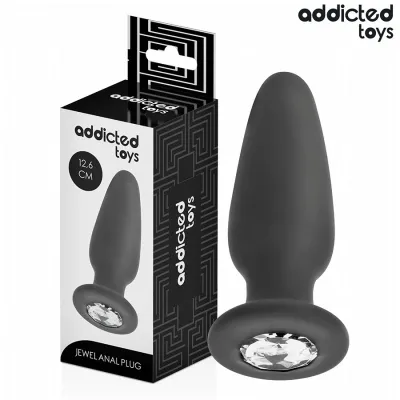 Black anal plug with gemstone, 12.6 cm, next to packaging from Addicted Toys.