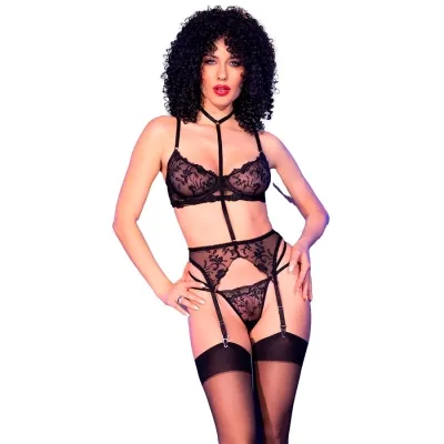 Person in black lace underwear with garter belts and curly hair against a white background.