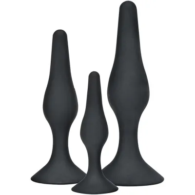 Three black, differently sized, conical objects with a wide base on a white background.