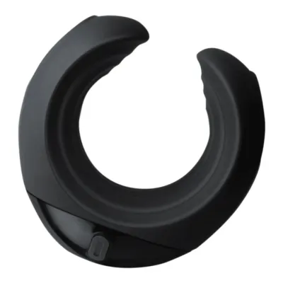 Black, semicircular object with a smooth surface and a small button on the underside.