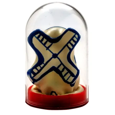 Plastic figure with a blue X-pattern in a transparent dome on a red base.