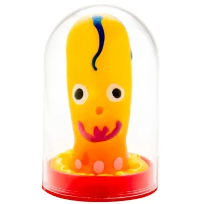 Yellow toy with a face and blue curl in a transparent dome with a red base.