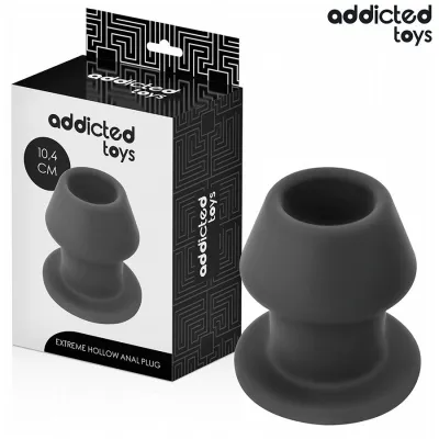 Schwarzer Analplug von Addicted Toys, 10,4 cm, neben der Verpackung mit geometrischem Muster.