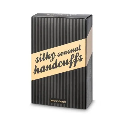 Schwarze Verpackung mit der Aufschrift "silky sensual handcuffs" in cremefarbenem Streifen.