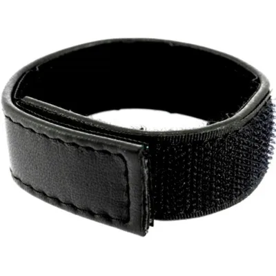 Black Velcro tape in ring form, suitable for bundling cables or other objects.