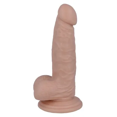 Realistisch geformtes Dildo mit Saugnapf, hautfarben, stehend aufrecht.