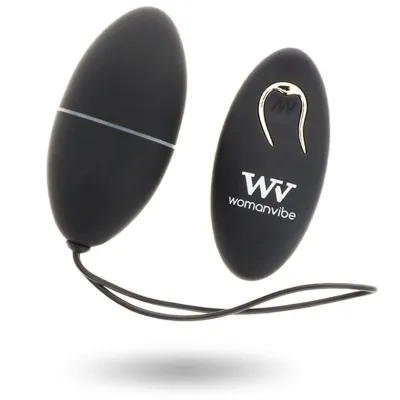 Black, egg-shaped vibrating device with remote control, brand "Womanvibe", on a white background.