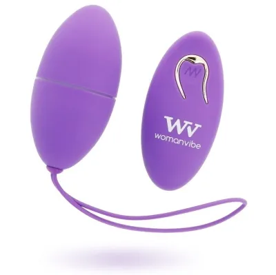 Purple vibrator egg with remote control, both with "Womanvibe" logo, on a white background.