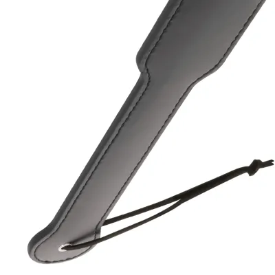 Close-up of a black leather strap with a loop at the end.
