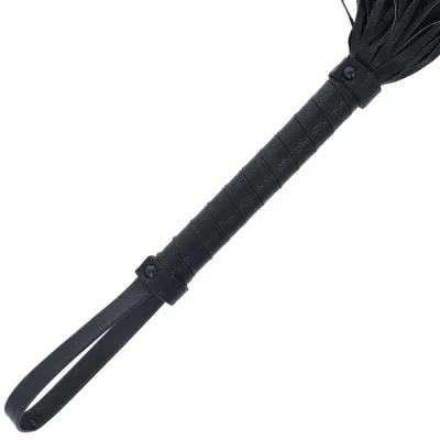Black leather handle with loop, part of a whip or similar object.