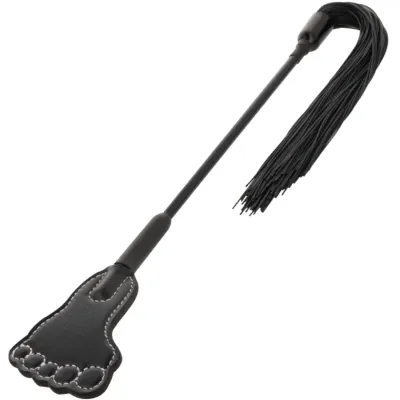 Black whip with a foot-shaped handle and fringes at the end.