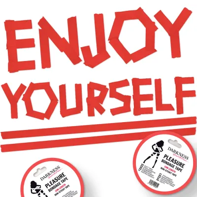 Red text "ENJOY YOURSELF" made of adhesive tape, with two rolls of bondage tape underneath.