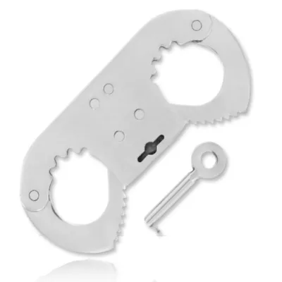 Silver handcuffs with key on a white background.