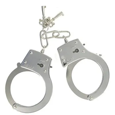 Silver handcuffs with two keys on a white background.