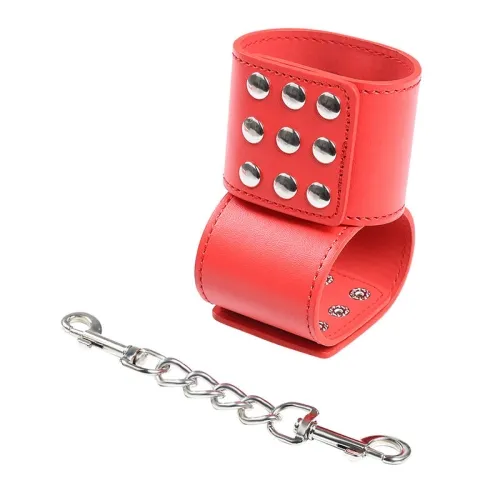 Red leather bracelet with silver studs and detachable chain.