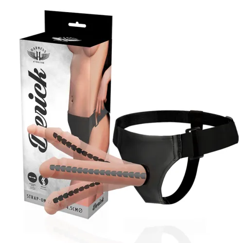 Strap-On-Set mit Verpackung, schwarzes Geschirr und hautfarbenem Dildo mit schwarzen Details, auf weißem Hintergrund.