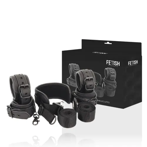 Black restraints with buckles and straps in front of a package labeled "Fetish Submissive".